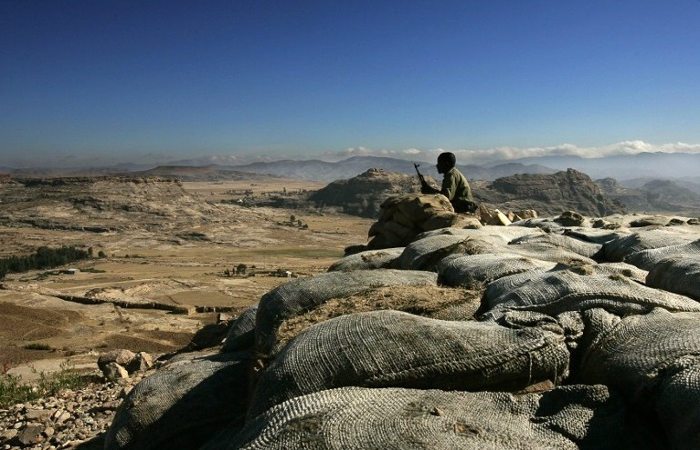 Photo - An Ethiopian soldier mans an observation post on the Eritrean border on 19 November 2005. [AFP - Marco Longari]