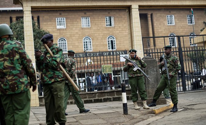 Photo - Officers outside the Supreme Court building in Nairobi, Kenya, on Friday